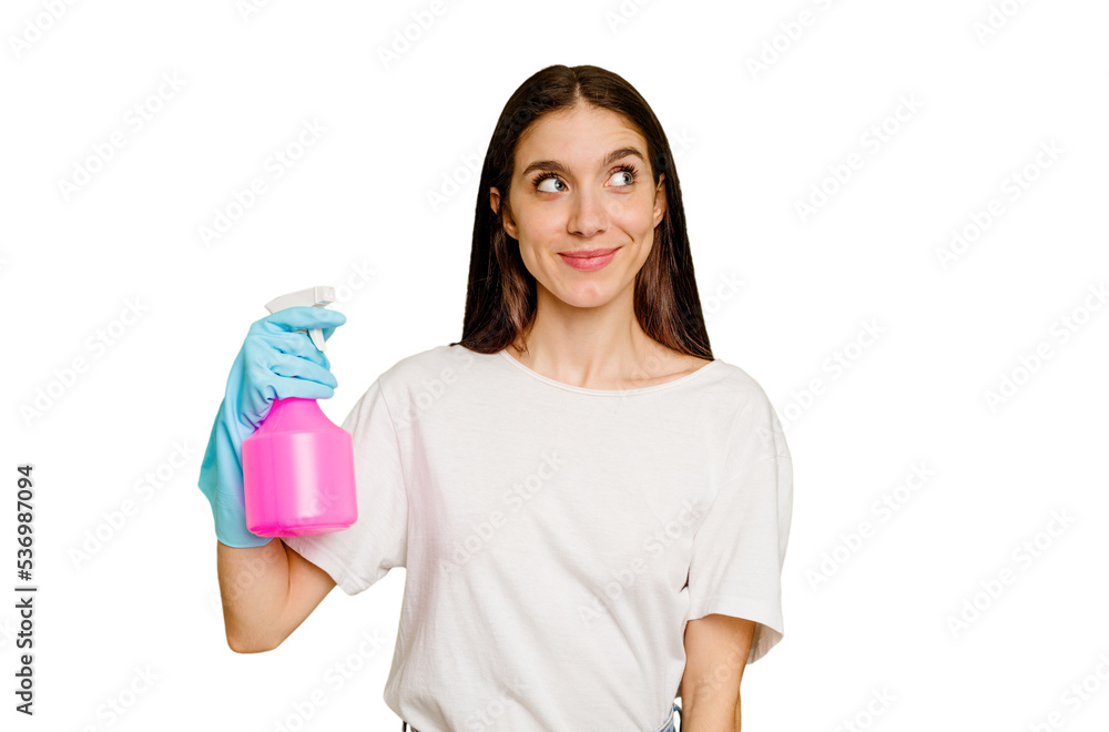 Young cleaner woman isolated dreaming of achieving goals and purposes Young cleaner woman isolated dreaming of achieving goals and purposes