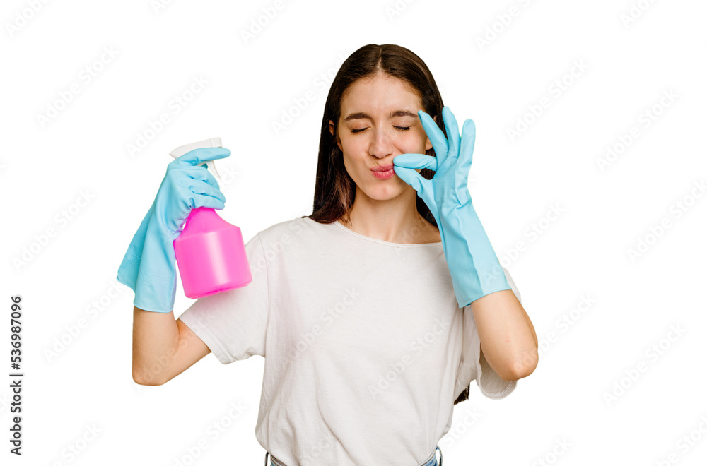 Young cleaner woman isolated with fingers on lips keeping a secret. Young cleaner woman isolated with fingers on lips keeping a secret.