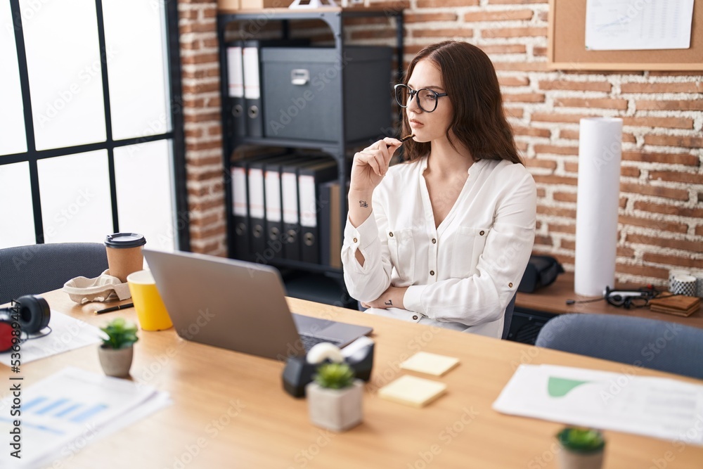Young woman business worker using laptop working at office Young woman business worker using laptop working at office