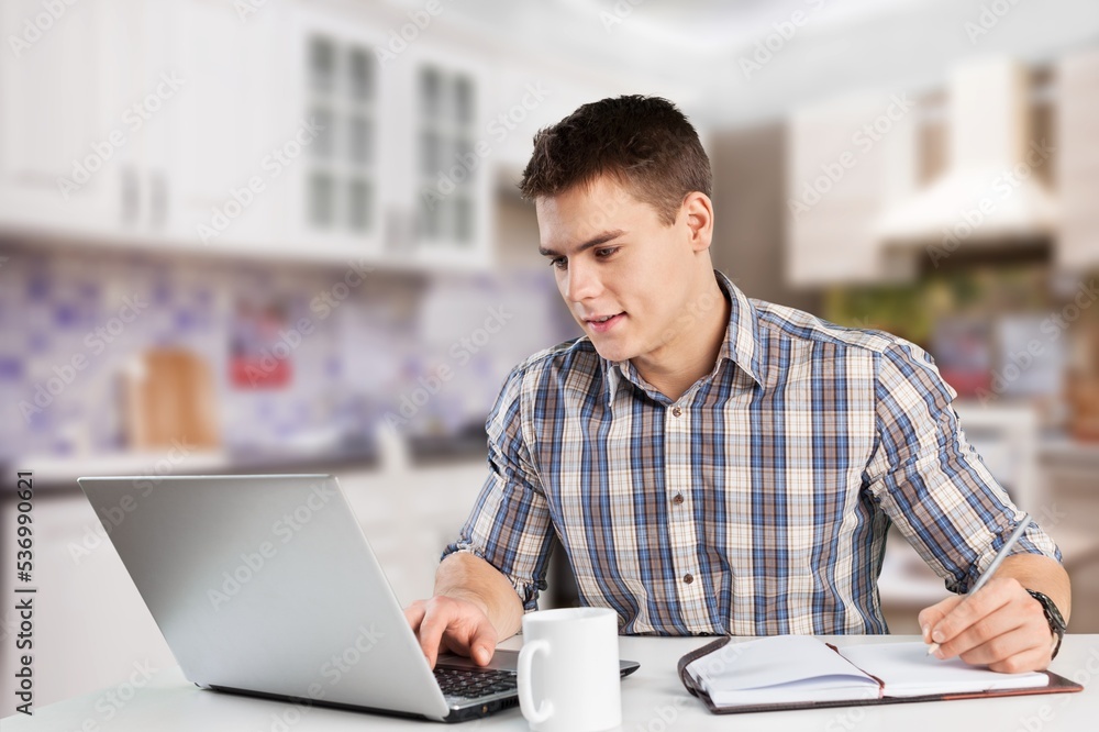 Young worker man at the table use computer Young worker man at the table use computer