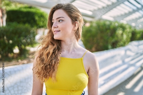 Young caucasian girl smiling confident at street