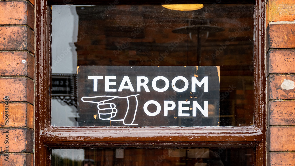 Fototapeta premium Tea room open sign in old wooden sash window
