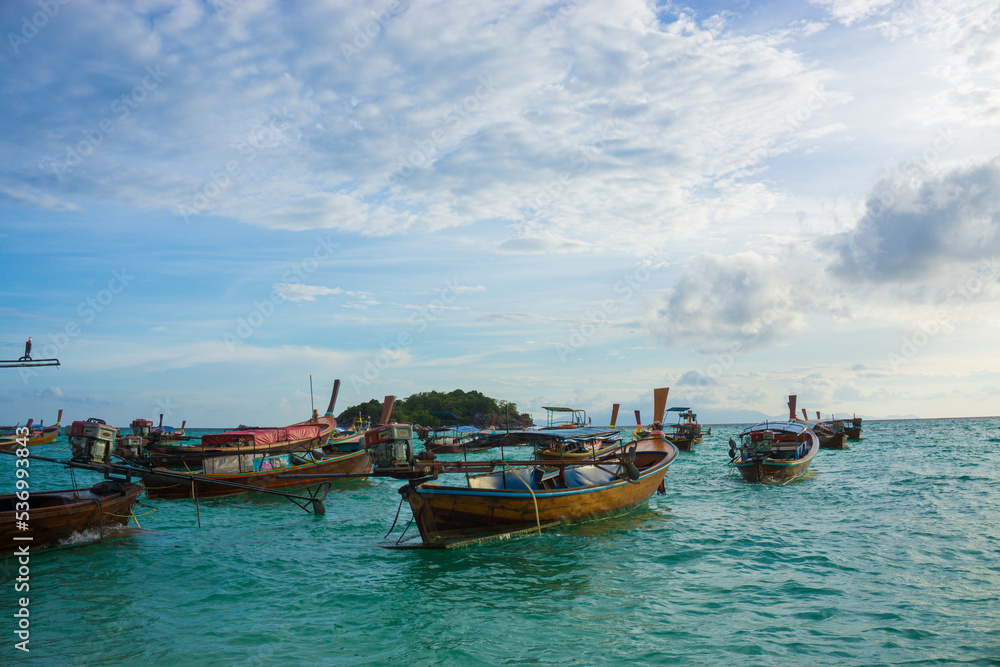 Wooden fishery boat on sea beach wave sunset cloud sky Wooden fishery boat on sea beach wave sunset cloud sky