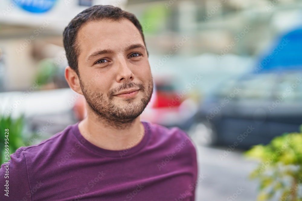 Young man smiling confident standing at street Young man smiling confident standing at street