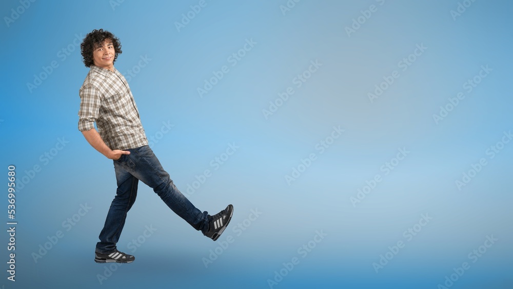 Happy young man posing on color background Happy young man posing on color background