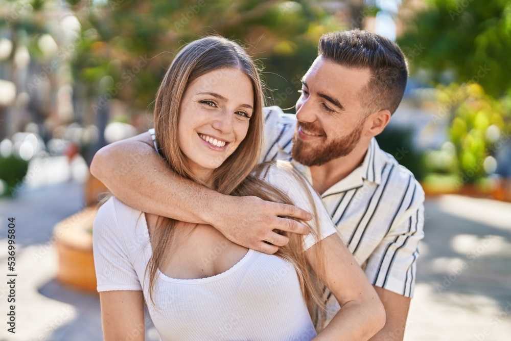 Man and woman couple smiling confident hugging each other at park Man and woman couple smiling confident hugging each other at park
