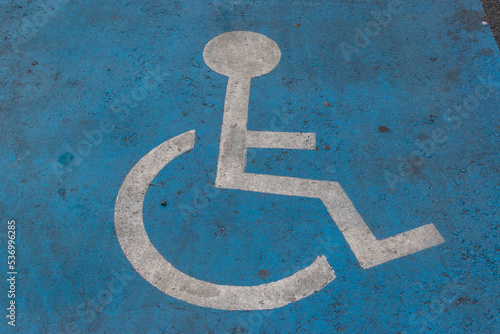 road marking on the road, person in a wheelchair