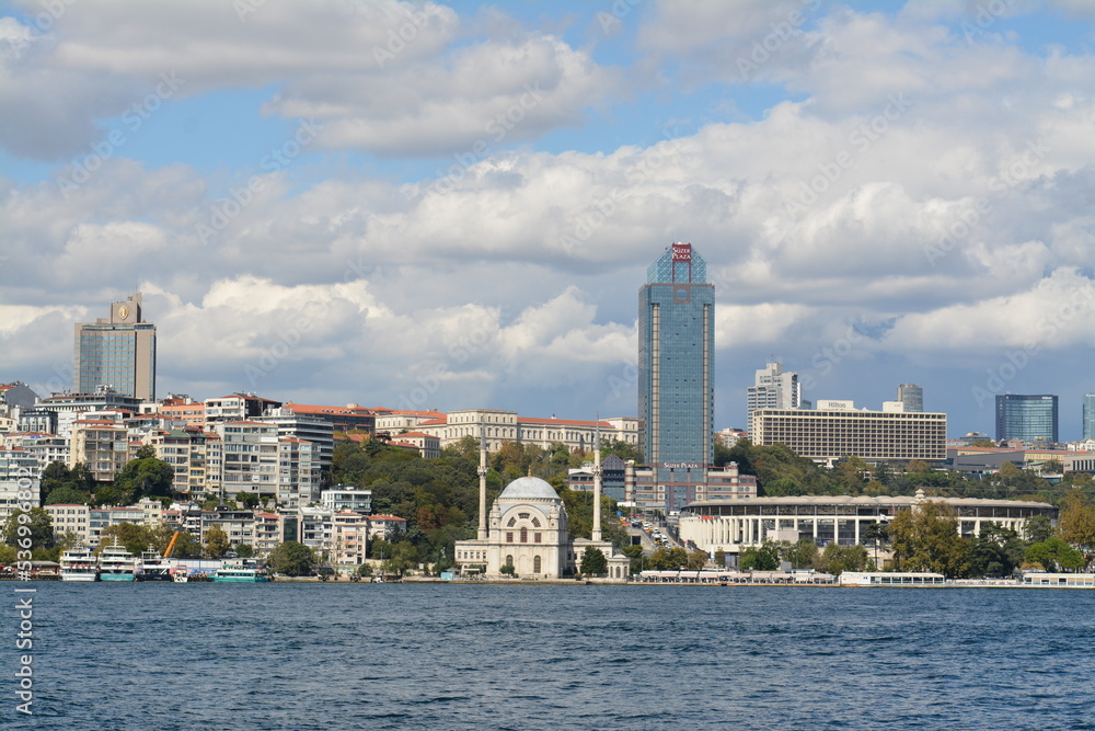 Fototapeta premium Istanbul water view, mansion, boats, sky and clouds