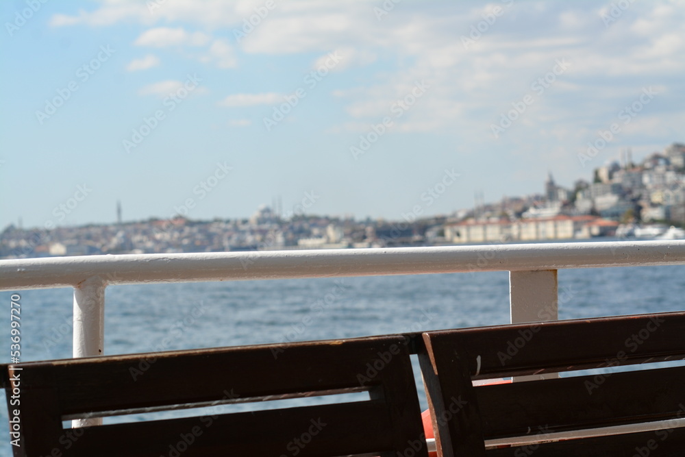 Istanbul water view, mansion, boats, sky and clouds