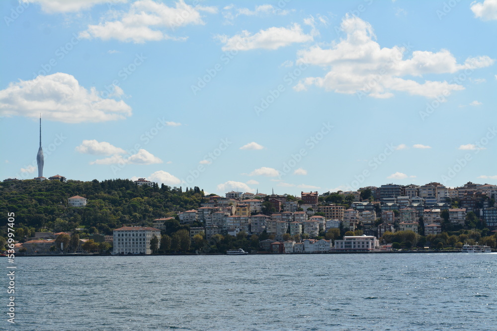Istanbul water view, mansion, boats, sky and clouds
