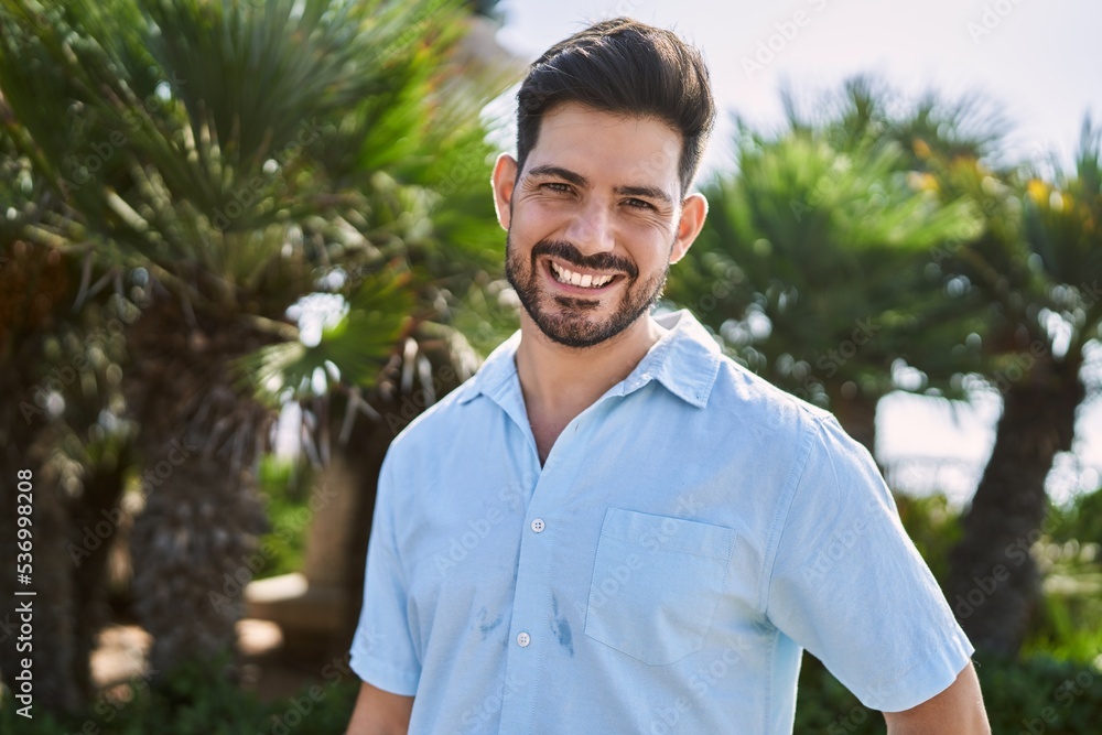 Young hispanic man smiling happy standing at the promenade Young hispanic man smiling happy standing at the promenade