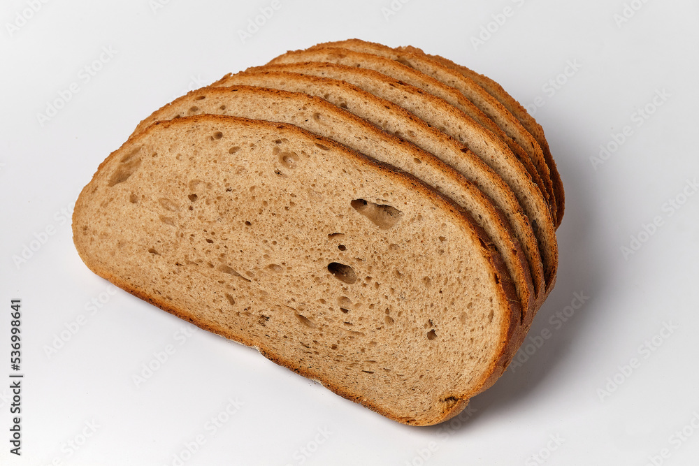 sliced pieces of black bread on a white background sliced pieces of black bread on a white background