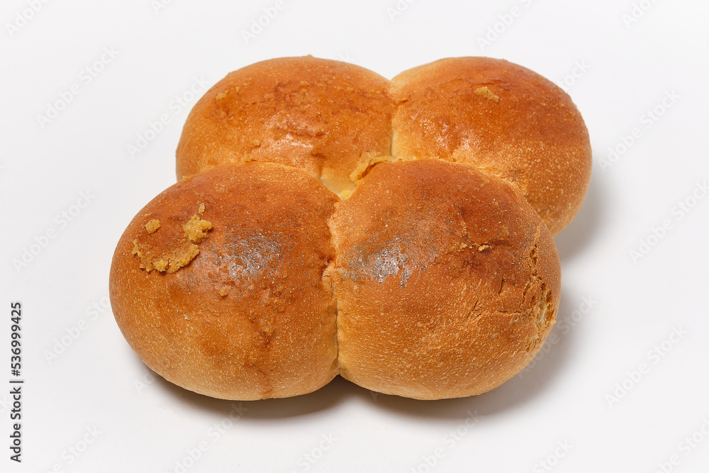 four buns fastened together on a white background