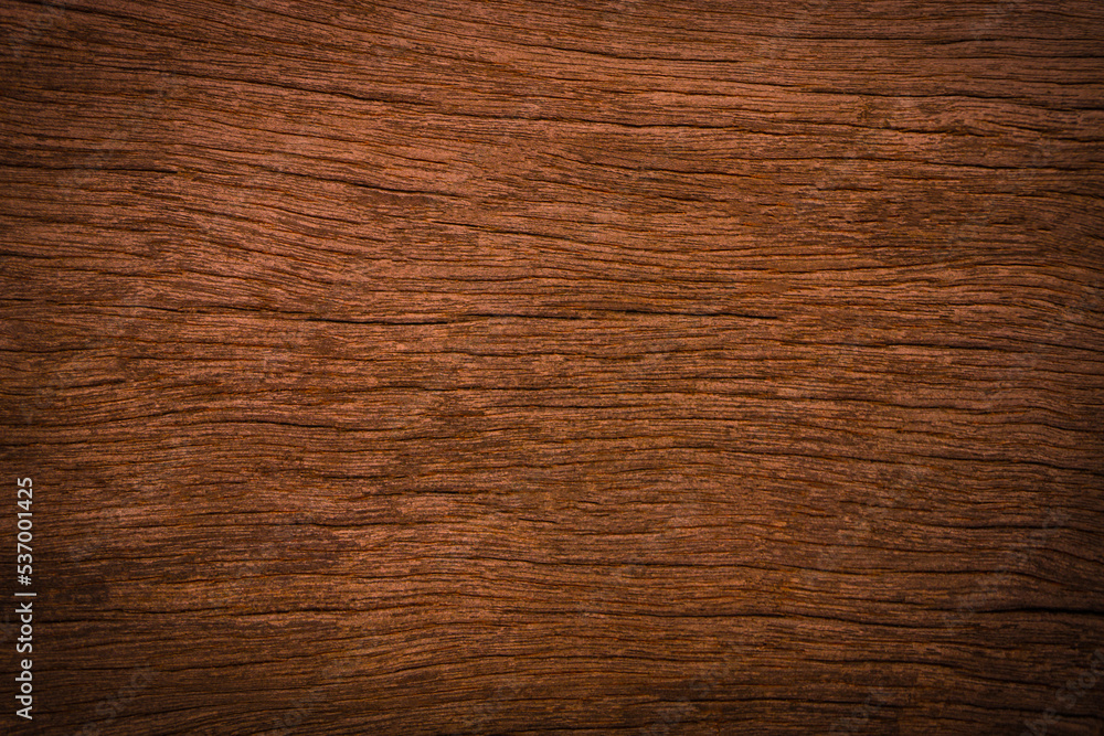 Old wood texture background with natural cracks. Dark brown wood plank is used for background. Old wood texture background with natural cracks. Dark brown wood plank is used for background.