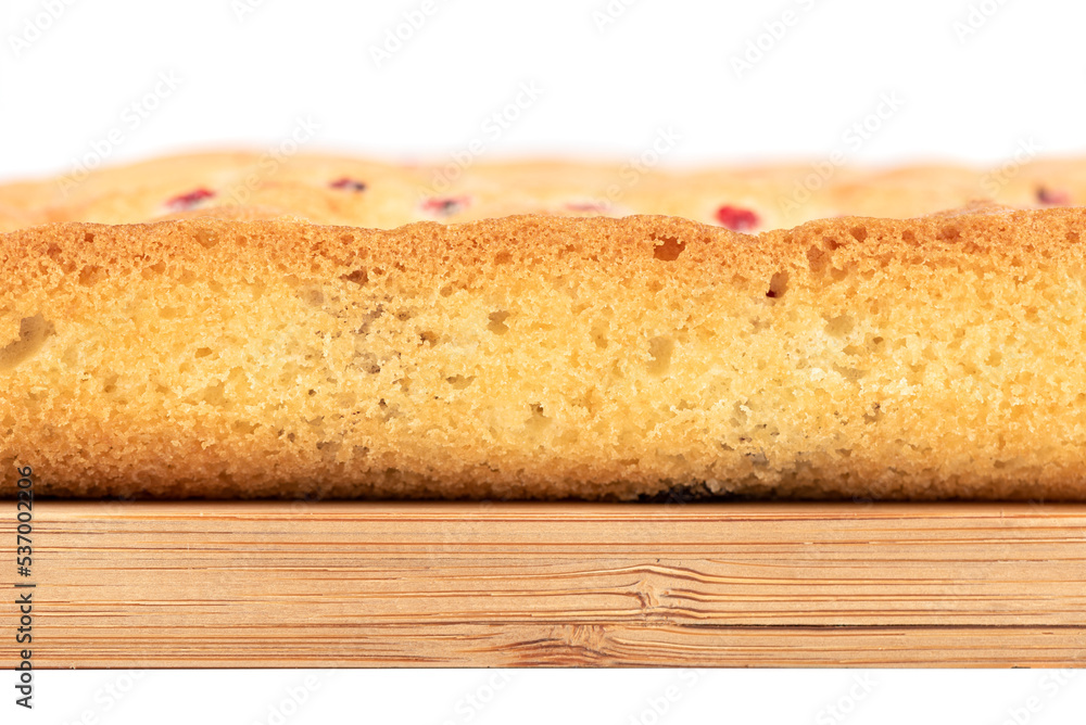 Close-up of a slice of a berry pie on a cutting board. Close-up of a slice of a berry pie on a cutting board.