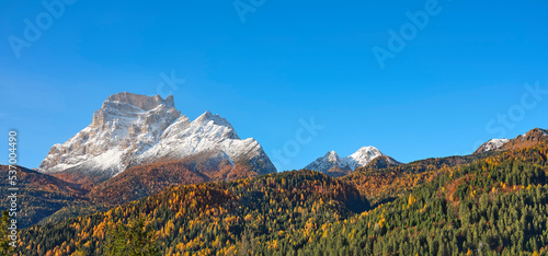 View of Monte Pelmo from S. Vito di Cadore, Belluno district, Veneto, Italy, Europe. Reflection of autumn foliage in the woods at the foot of Monte Pelmo in the Boite valley, Dolomites.