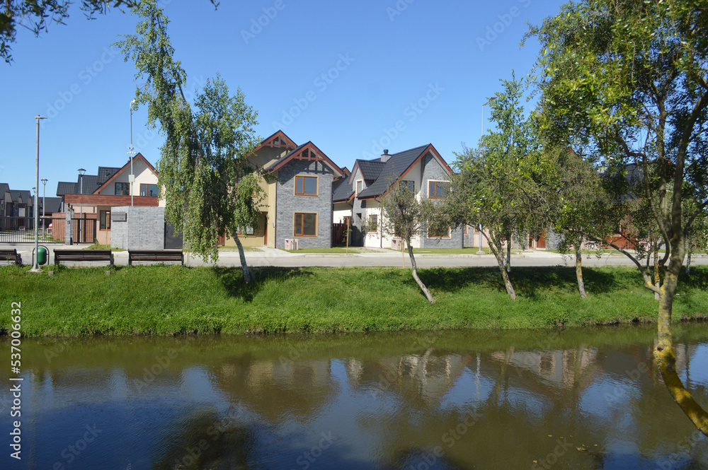 houses of an urbanization and a beautiful river in Chile houses of an urbanization and a beautiful river in Chile
