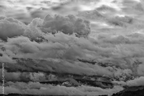 black and white clouds above the mountains
