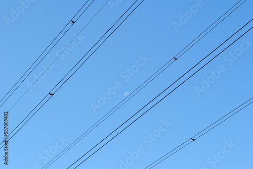 Steel Power Transmission Cables against Blue Sky 