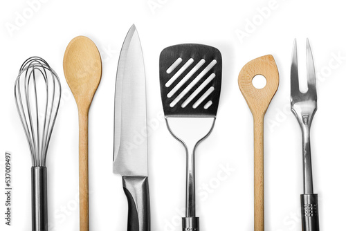 Set of modern steel kitchen utensils on wooden table photo