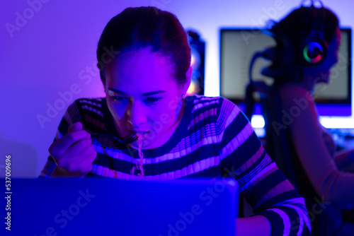 Asian women who rely heavily on computers to watch drama series until having to eat instant noodles in front of it, © Wosunan