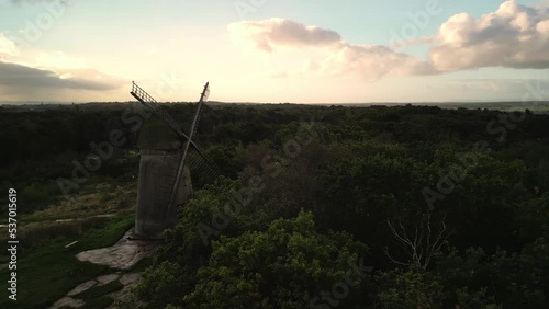 Bidston Windmill at dawn, aerial drone clockwise storm cloud reveal photo