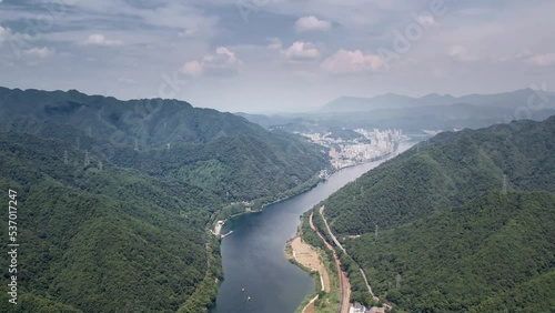 Wallpaper Mural green hills and river in cloud sky Torontodigital.ca