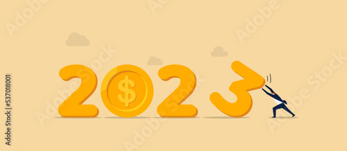 Year 2023 business target, new year resolution or challenge to achieve goal, aim for business success, growth or motivation to succeed concept, businessman changing year to 2023 target.