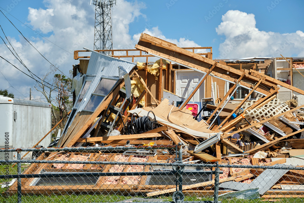 Badly damaged mobile home after hurricane Ian in Florida residential area. Consequences of natural disaster Badly damaged mobile home after hurricane Ian in Florida residential area. Consequences of natural disaster