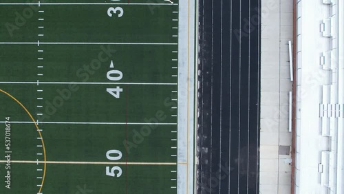 4K aerial of an American turf football field moving toward the endzone photo