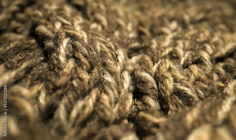 Knitted warm wool fabric texture. Close-up. Knitted warm wool fabric texture. Close-up.
