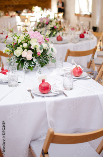 Beautiful wedding decoration. Banquet table setting and decoration. Flower decoration of wedding tables. Cutlery on the table.