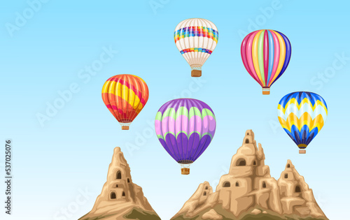 Hot air balloons fly over mountains of Cappadocia in Turkey vector illustration. Cartoon Turkish landscape with rocks and nature, romantic flight of balloons with color pattern and baskets in blue sky