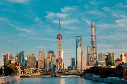 Photography Aerial view of cityscape Shanghai surrounded by buildings and water