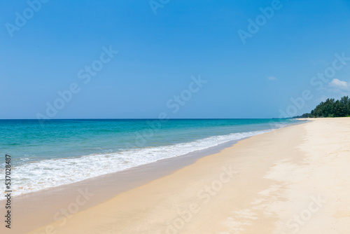 Wallpaper Mural Tropical beach background, clean sandy beach with blue sea background, summer outdoor day light Torontodigital.ca