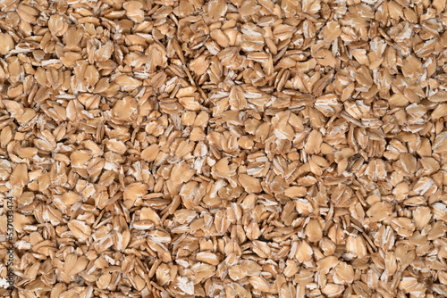 Oat flakes texture background, close up. oatmeal. barley flakes. rolled oat