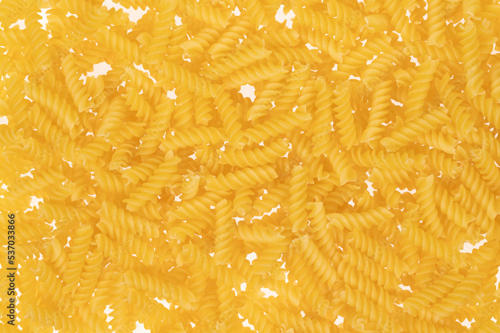 Spiral pasta on white background. texture closeup Spiral pasta on white background. texture closeup