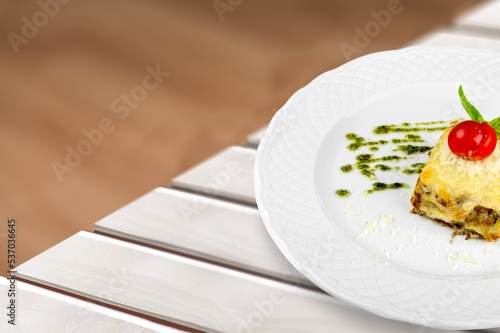 Tasty fresh lasagna dish on white plate