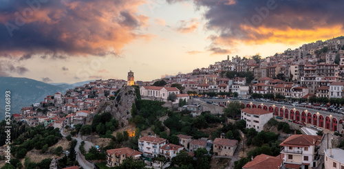 Arachova Greece mountain town aerial drone view. Traditional houses at sunset