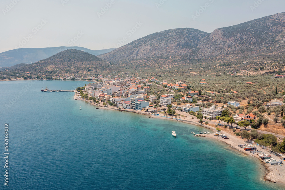 Antikyra Greece, aerial drone view. Coastal village boats and beach in Boeotia