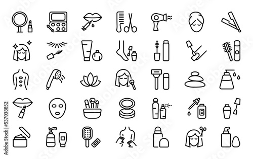 Set of 35 beauty icons in line style. Makeup brush, lipstick, cream bottle, face and body care products, massage. Vector illustration.