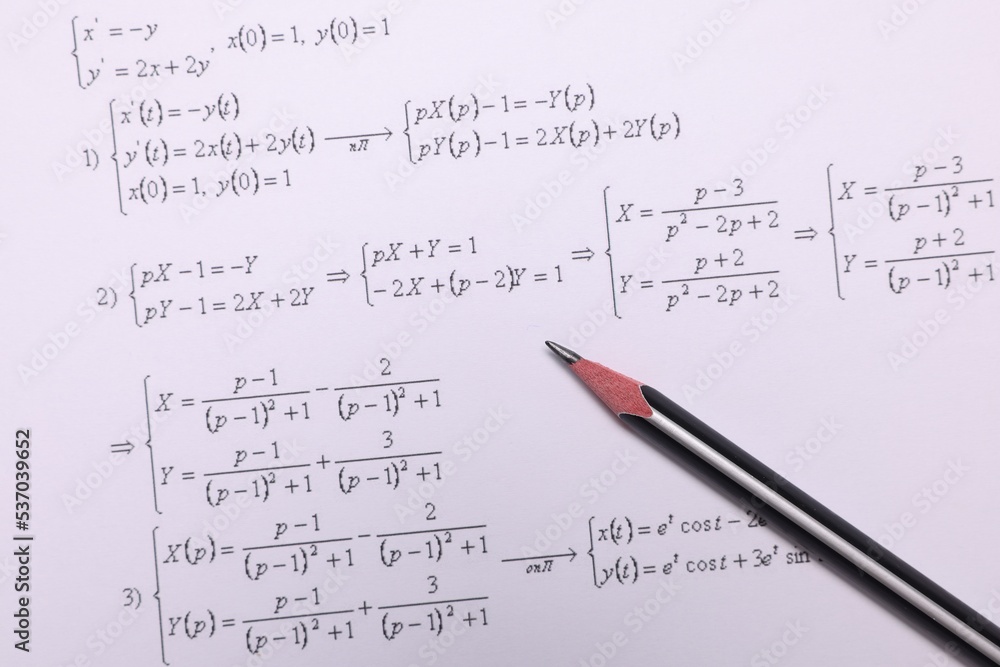 Sheet of paper with mathematical formulas and pencil, top view Sheet of paper with mathematical formulas and pencil, top view