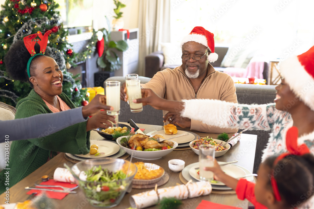 Happy african american family spending time together having christmas meal Happy african american family spending time together having christmas meal