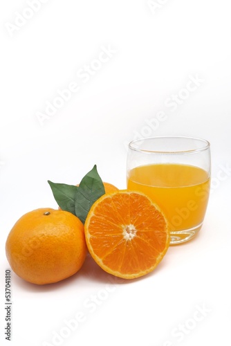 glass juice and two fresh orange mandarin with white background  concept vitamin C  natural  organic  beauty  product  health nutrition  drink