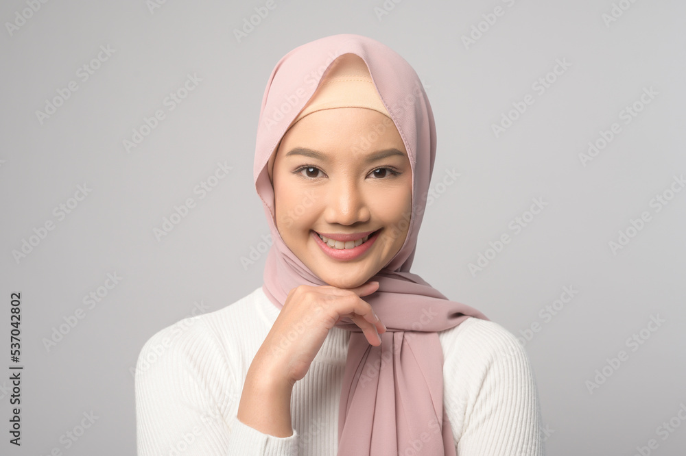 Portrait of beautiful muslim woman with hijab over white background studio. Portrait of beautiful muslim woman with hijab over white background studio.