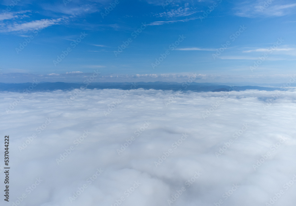 Landscape above the layer of clouds