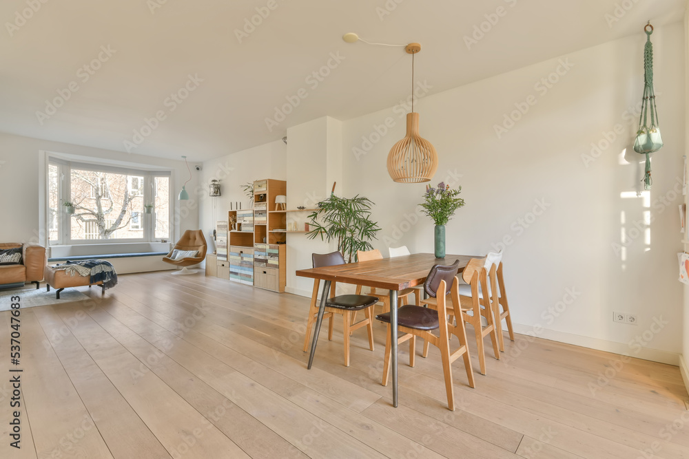 Spacious living room with dining table Spacious living room with dining table