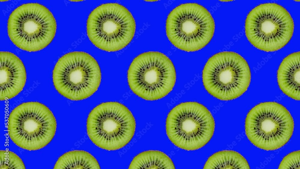 Minimal motion design - Kiwi slices rotating and moving down at blue color background. Trendy colors and style graphics. Seamless looping animation. Minimal motion design - Kiwi slices rotating and moving down at blue color background. Trendy colors and style graphics. Seamless looping animation.