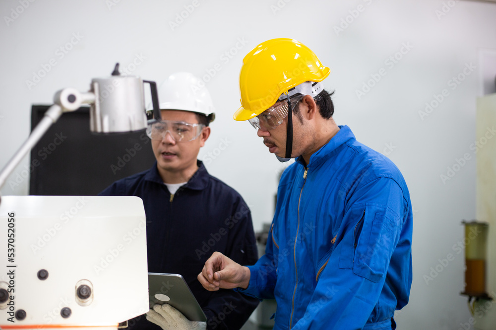experienced operator technician worker or engineer metalworker industrial in safety helmet working or repair on metal machine, professional maintenance skill man in industry manufacturing. men at work experienced operator technician worker or engineer metalworker industrial in safety helmet working or repair on metal machine, professional maintenance skill man in industry manufacturing. men at work