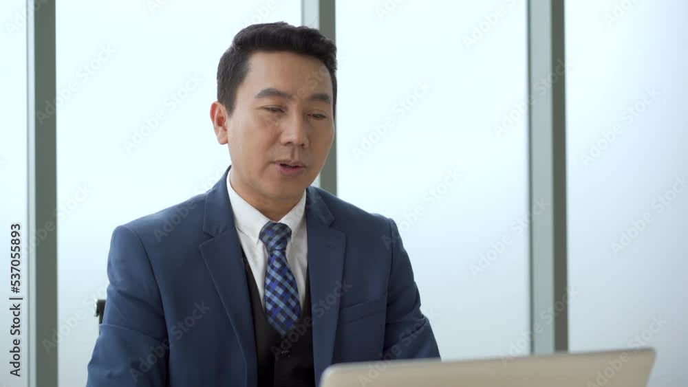 businessman using laptop computer or notebook for online video conference in the meeting room. businessman using laptop computer or notebook for online video conference in the meeting room.